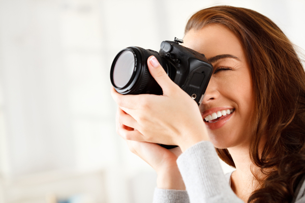 woman-taking-photos-with-dslr-camera